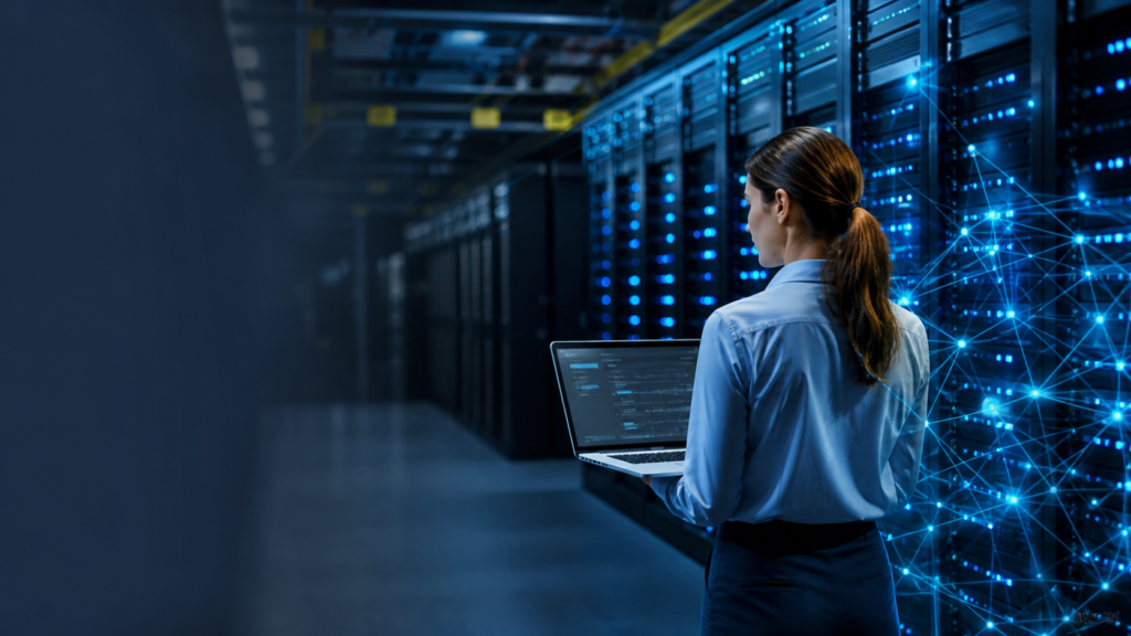 Profissional de tecnologia observa servidores iluminados em um data center, representando o uso da inteligência artificial e a geração de empregos na área.